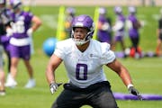 Minnesota Vikings outside linebacker Marcus Davenport (0) runs a drill during offseason organized team activities Tuesday, May 23, 2023, at the TCO Pe