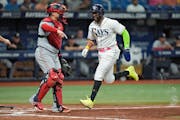 Tampa Bay’s Yandy Díaz, seen at right scoring in front of Twins catcher Christian Vázquez on June 6 in St. Petersburg, Fla., hit a walk-off home r