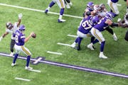 Vikings quarterback Kirk Cousins (8) was pressured by Buccaneers safety Antoine Winfield Jr. on Sunday at U.S. Bank Stadium.