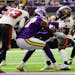Tampa Bay Buccaneers safety Christian Izien (29) intercepts a pass intended for Minnesota Vikings wide receiver K.J. Osborn (17).