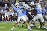 North Carolina quarterback Drake Maye threw a pass during a double-overtime victory over Appalachian State on Saturday in Chapel Hill.