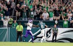 Eagles running back D’Andre Swift tried to elude Vikings safety Josh Metellus in the fourth quarter Thursday night in Philadelphia, when Swift ran f