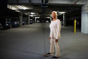 Linda Cobb stands for a portrait inside the parking garage at The Legends at Silver Lake in St. Anthony, Minn., on Friday, Sept. 15, 2023. Cobb and ot