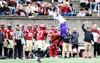 St. Thomas’ Andrew McElroy made a leaping catch in the third quarter at Harvard on Saturday.