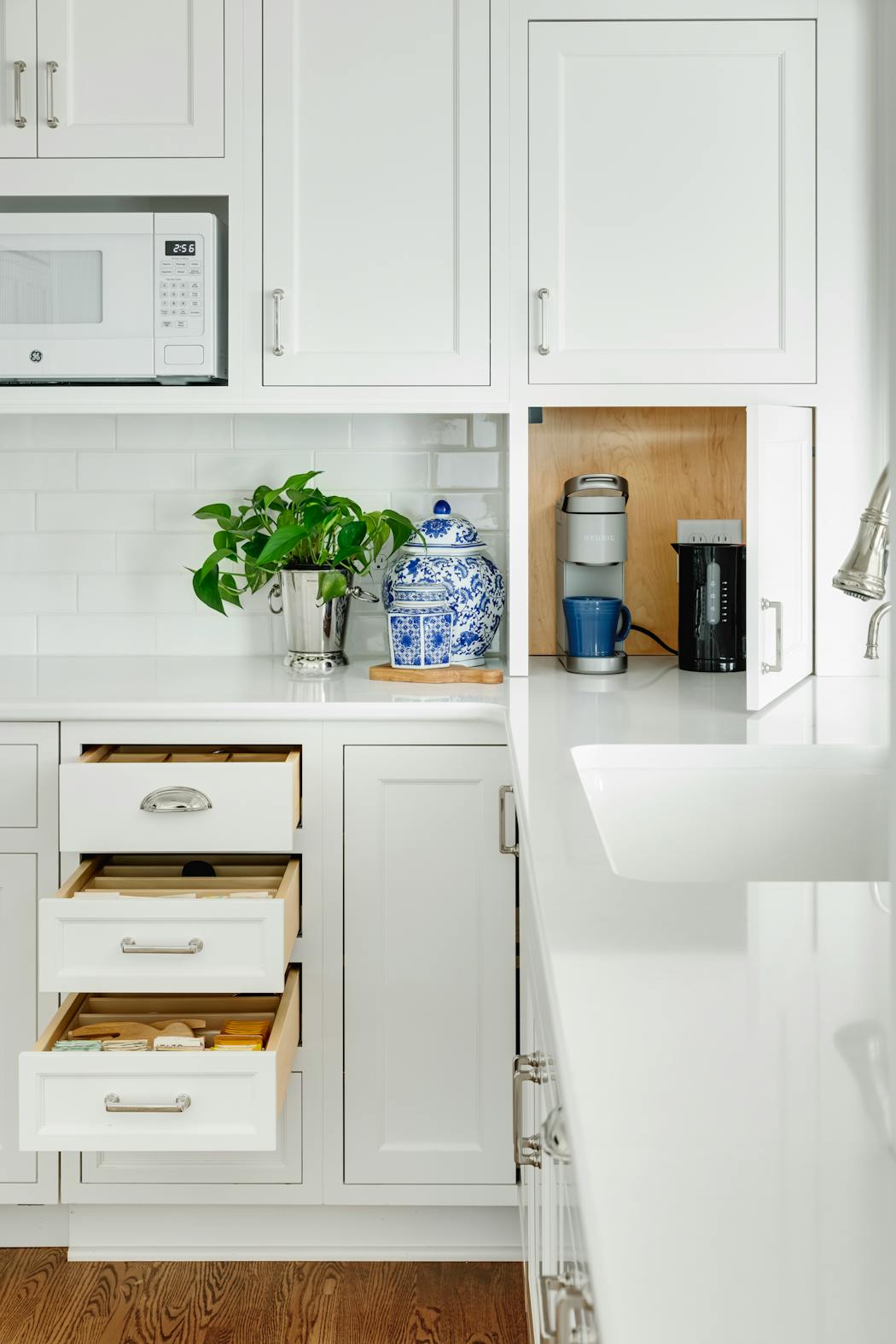 The homeowners love coffee and tea, and cabinets and drawers make it easy to make a cup while keeping things tucked away.