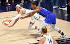 The Lynx’s Napheesa Collier (24) and the Sun’s Alyssa Thomas (25) dove for a loose ball during the Lynx’s 82-75 victory in Game 2 of a first-rou