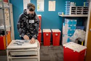 Gabe Lyrek, a harm reduction specialist at the NorthPoint Health and Wellness Harm Reduction Center, demonstrates how to use fentanyl testing strips i