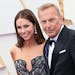 Christine Baumgartner and Kevin Costner attend the 94th Annual Academy Awards at Hollywood and Highland on March 27, 2022, in Hollywood, California. 