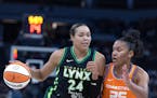 The Lynx’s Napheesa Collier drove against the Sun’s Alyssa Thomas in the first quarter Wednesday night at Target Center. Collier had 31 points in 