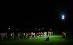 Runners competed Saturday under the lights at Eden Prairie’s Metro Invitational. 