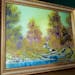“A Walk in the Woods,” the first painting Bob Ross produced for hic iconic show “The Joy of Painting,” on display at the home of Modern Artifa