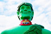 The Green Giant in Blue Earth, Minn., is among landmarks that will wrapped in “Survivor’s” signature bandana.