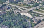 An early-stage rendering of a proposed middle-income apartment in western Edina. The interchange of Highway 169 and Bren Road is behind the building.