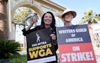 Fran Drescher, left, president of SAG-AFTRA, and Meredith Stiehm, president of Writers Guild of America West, pose together during a rally by striking