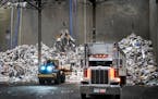 Waste is trucked in before being going into a boiler and being converted into energy at the Hennepin Energy Recovery Center, or HERC, in February 2023