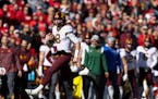 Minnesota quarterback Athan Kaliakmanis (8) rushes against Nebraska during the second half of an NCAA college football game Saturday, Nov. 5, 2022, in