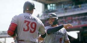 Donovan Solano and Christian Vazquez of the Twins celebrated during a rally on Wednesday in their victory over host Cincinnati.