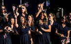 Members of Team USA cheer during the opening ceremony of the Solheim Cup in Marbella, Spain, on Thursday