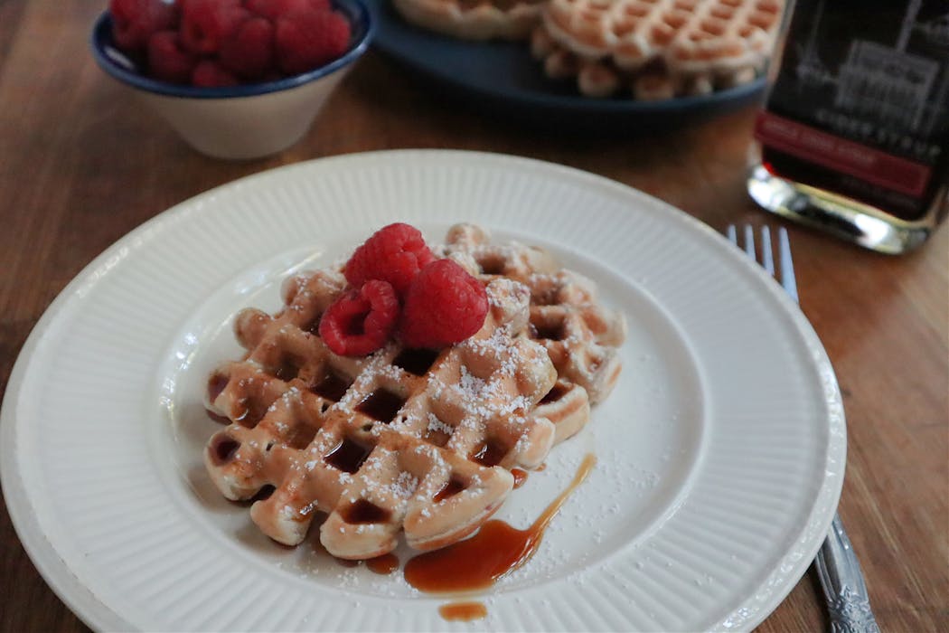 Whole-wheat waffles are sweetened with raspberries and vanilla. Sans syrup, they’re a perfect grab-and-go bite.