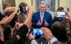 Speaker of the House Kevin McCarthy, R-Calif., is surrounded by reporters looking for updates on plans to fund the government and avert a shutdown, at