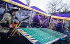 Brady Gillespie takes on Tim Schussed in a game of ping pong at a tailgate party near US Bank Stadium before the Vikings take on the Patriotsl in Minn