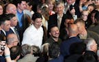Prime Minister Justin Trudeau, center left, and Ukrainian President Volodymyr Zelenskyy, center right, greet people at a rally at the Fort York Armour