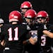 Eden Prairie players gathered to celebrate a touchdown by Luca Ratkovich (11) during their 42-28 victory Friday over Shakopee. Eden Prairie was ranked