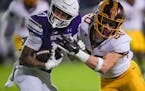 Gophers defensive back Jack Henderson puts a hit on Northwestern wide receiver Bryce Kirtz during the first half 