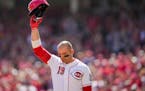 Longtime Reds star Joey Votto acknowledged the Cincinnati crowd as he stood at home plate during the second inning of Sunday’s game against the Pira