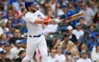 The Cubs’ Patrick Wisdom watched his two-run homer during the sixth inning against the Rockies on Sunday.