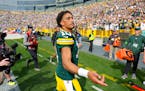 Packers quarterback Jordan Love (10) walked off the field after beating the Saints on Sunday in Green Bay, Wis.