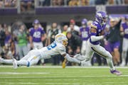 Vikings wide receiver Justin Jefferson broke the grasps of Chargers safety JT Woods on his way to a 52-yard touchdown in the fourth quarter Sunday.