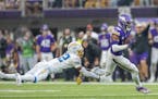Vikings wide receiver Justin Jefferson broke the grasps of Chargers safety JT Woods on his way to a 52-yard touchdown in the fourth quarter Sunday.
