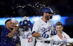 The Dodgers’ Chris Taylor (3) celebrated his winning single to beat the Giants on Sunday in Los Angeles.