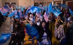 Women cheered a speaker early in the evening’s program while awaiting the arrival of Somali Prime Minister Hamza Abdi Barre. Somali Prime Minister H