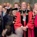 After being presented with both the Presidential medals from the College of St. Benedict and St. John’s University, Brian Bruess acknowledged the cr