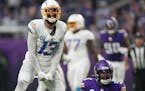 Los Angeles Chargers wide receiver Keenan Allen (13) reacts after completing a pass past Minnesota Vikings linebacker Jordan Hicks (58) in the fourth 