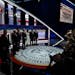 Candidates face a battery of photographers just before the first Republican presidential primary debate, at the Fiserv Forum in Milwaukee on Aug. 23, 