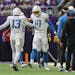 Los Angeles Chargers quarterback Justin Herbert (10) celebrates with wide receiver Keenan Allen (13) after Allen threw a touchdown pass against the Vi