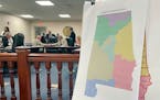 FILE - A map of a GOP proposal to redraw Alabama’s congressional districts is displayed at the Alabama Statehouse in Montgomery, Ala., July 18, 2023