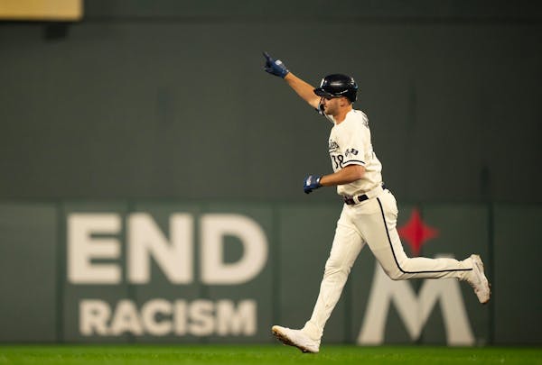 Minnesota Twins left fielder Matt Wallner celebrated as he rounded the bases after he hit a grand slam in the first inning. The Minnesota Twins faced 