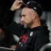 Minnesota Twins manager Rocco Baldelli sits in the dugout during the first inning of a baseball game against the Chicago White Sox, Friday, Sept. 15, 