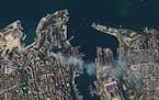 In this satellite photo provided by Planet Labs, smoke billows from a headquarters building for the Russian Black Sea fleet in Sevastopol, Crimea on F