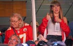 Donna Kelce, left, mother of Kansas City Chiefs tight end Travis Kelce, watches the game with pop superstar Taylor Swift during the first half on Sund