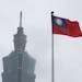 A Taiwan national flag flutters near the Taipei 101 building at the National Dr. Sun Yat-sen Memorial Hall in Taipei in May.