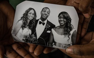Kirby Puckett Jr. and his sister Catherine Puckett held one of their favorite photos, taken when their mom (left) remarried in 2013.