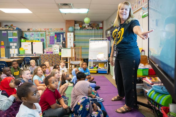 First-grade teacher Elisa Odegard led her students in a morning song at Gideon Pond Elementary School in Burnsville.