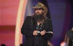 Chris Stapleton accepted the award for entertainer of the year at the 58th annual Academy of Country Music Awards in May.
