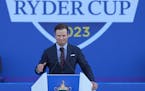 United States Captain Zach Johnson gestures as he makes a speech during the Ryder Cup opening ceremony at the Marco Simone Golf Club in Guidonia Monte