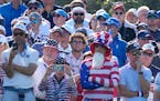 United States fans watch the action on the 15th green during Friday’s Ryder Cup play. 